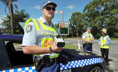 Senior Constable Adam Williams checks speeds along Hogbin Dr with Sergeant Brett Jackson and Anne Shearer from the Coffs City Council. Senior Constable Adam Williams checks speeds along Hogbin Dr with Sergeant Brett Jackson and Anne Shearer from the Coffs City Council.